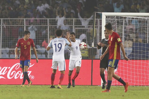 England’s Rhian Brewster, holding ball, celebrates after scoring a goal during the FIFA U-17 World Cup final match between England and Spain in Kolkata, India, Saturday, Oct. 28, 2017. (AP Photo/Anupam Nath)