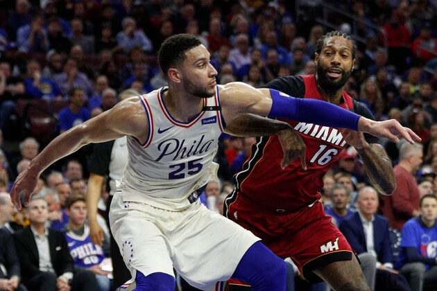 Philadelphia 76ers' Ben Simmons, left, of Australia, blocks out Miami Heat's James Johnson, right, during the first half in Game 2 of a first-round NBA basketball playoff series, Monday, April 16, 2018, in Philadelphia. The Heat won 113-103. (AP Photo/Chris Szagola)