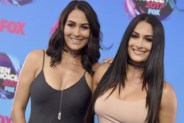 Brie Bella, left, and Nikki Bella arrive at the Teen Choice Awards at the Galen Center on Sunday, Aug. 13, 2017, in Los Angeles. (Photo by Jordan Strauss/Invision/AP) Brie Bella, left, and Nikki Bella arrive at the Teen Choice Awards at the Galen Center on Sunday, Aug. 13, 2017, in Los Angeles. (Photo by Jordan Strauss/Invision/AP)