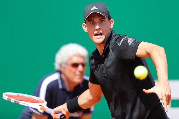 Austria's Dominic Thiem returns the ball to Serbia's Novak Djokovic during their tennis match as part of the Monte-Carlo ATP Masters Series Tournament, on April 19, 2018 in Monaco. (Photo by VALERY HACHE / AFP)        (Photo credit should read VALERY HACHE/AFP/Getty Images)