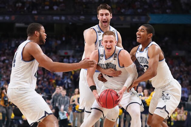 SAN ANTONIO, TX - APRIL 02:  Donte DiVincenzo #10 of the Villanova Wildcats celebrates with teammates after defeating the Michigan Wolverines during the 2018 NCAA Men's Final Four National Championship game at the Alamodome on April 2, 2018 in San Antonio, Texas. Villanova defeated Michigan 79-62.  (Photo by Tom Pennington/Getty Images)