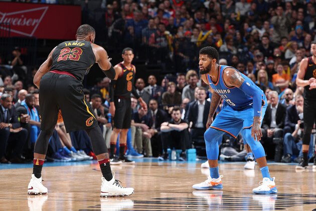 OKLAHOMA CITY, OK - FEBRUARY 13: Paul George #13 of the Oklahoma City Thunder defends LeBron James #23 of the Cleveland Cavaliers during the game on February 13, 2018 at Chesapeake Energy Arena in Oklahoma City, Oklahoma. NOTE TO USER: User expressly acknowledges and agrees that, by downloading and/or using this photograph, user is consenting to the terms and conditions of the Getty Images License Agreement. Mandatory Copyright Notice: Copyright 2018 NBAE (Photo by Joe Murphy/NBAE via Getty Images)
