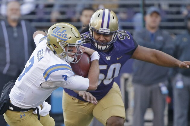 UCLA quarterback Josh Rosen is chased by Washington's Vita Vea in the first half of an NCAA college football game Saturday, Oct. 28, 2017, in Seattle. (AP Photo/Elaine Thompson)