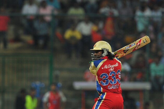 Royal Challenger's Bangalore batsman Chris Gayle plays a shot during the IPL Twenty20 cricket match between Royal Challenger Bangalore and Kings XI Punjab at the M. Chinnaswamy Stadium in Bangalore on May 2, 2012. RESTRICTED TO EDITORIAL USE. MOBILE USE WITHIN NEWS PACKAGE. AFP PHOTO/Manjunath KIRAN        (Photo credit should read Manjunath Kiran/AFP/GettyImages)