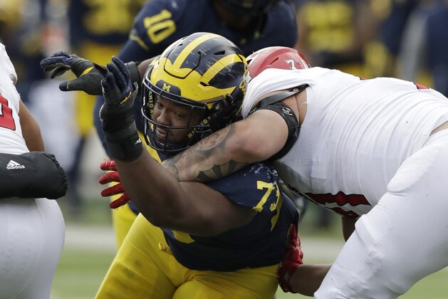 Michigan defensive lineman Maurice Hurst (73) goes up against Rutgers offensive lineman Marcus Applefield during the second half of an NCAA college football game, Saturday, Oct. 28,2017, in Ann Arbor, Mich. (AP Photo/Carlos Osorio)