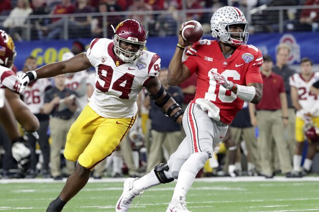 Ohio State quarterback J.T. Barrett (16) is chased by Southern California defensive tackle Rasheem Green (94) during the first half of the Cotton Bowl NCAA college football game in Arlington, Texas, Friday, Dec. 29, 2017. (AP Photo/LM Otero) Ohio State quarterback J.T. Barrett (16) is chased by Southern California defensive tackle Rasheem Green (94) during the first half of the Cotton Bowl NCAA college football game in Arlington, Texas, Friday, Dec. 29, 2017. (AP Photo/LM Otero)