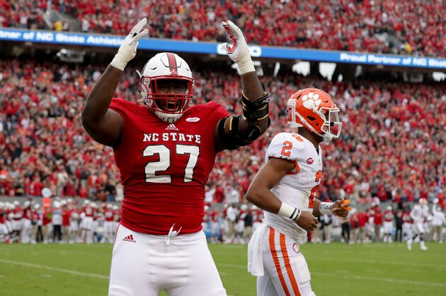 RALEIGH, NC - NOVEMBER 04:  Justin Jones #27 of the North Carolina State Wolfpack reacts after a play as Kelly Bryant #2 of the Clemson Tigers walks off the field during their game at Carter Finley Stadium on November 4, 2017 in Raleigh, North Carolina.  (Photo by Streeter Lecka/Getty Images)