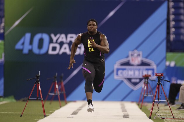 Delaware defensive lineman Bilal Nichols runs the 40-yard dash at the NFL football scouting combine in Indianapolis, Sunday, March 4, 2018. (AP Photo/Michael Conroy)
