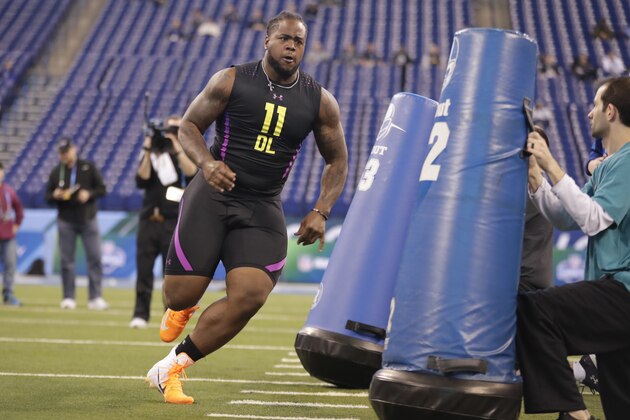 Tennessee defensive lineman Kahlil McKenzie runs a drill at the NFL football scouting combine in Indianapolis, Sunday, March 4, 2018. (AP Photo/Michael Conroy)