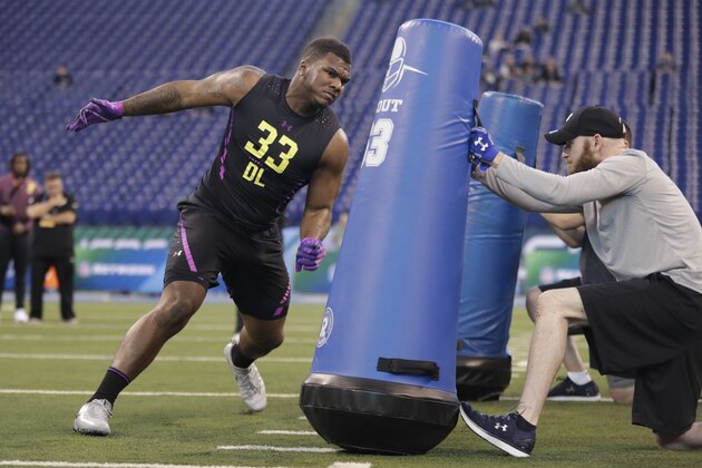 Stephen F Austin defensive lineman John Franklin-Myers runs a drill at the NFL football scouting combine in Indianapolis, Sunday, March 4, 2018. (AP Photo/Michael Conroy)
