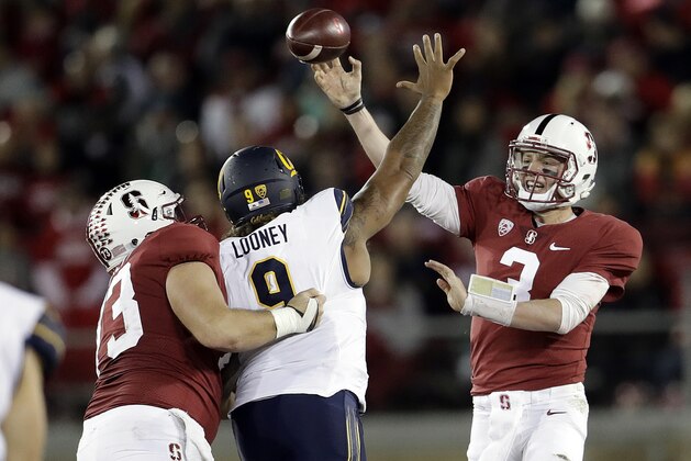 Stanford quarterback K.J. Costello (3) throws under pressure from California defensive end James Looney (9) during the first half of an NCAA college football game Saturday, Nov. 18, 2017, in Stanford, Calif. (AP Photo/Marcio Jose Sanchez)