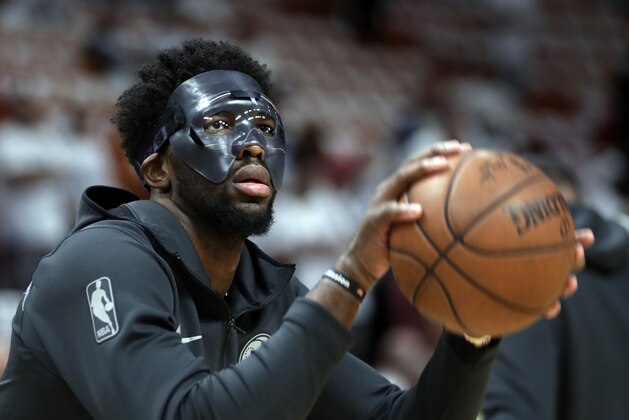 Philadelphia 76ers center Joel Embiid shoots before Game 3 of a first-round NBA basketball playoff series against the Miami Heat, Thursday, April 19, 2018, in Miami. (AP Photo/Lynne Sladky)