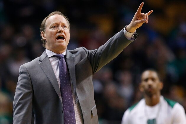 Atlanta Hawks head coach Mike Budenholzer signals during the third quarter of an NBA basketball game against the Boston Celtics in Boston, Sunday, April 8, 2018. The Hawks won 112-106. (AP Photo/Michael Dwyer)