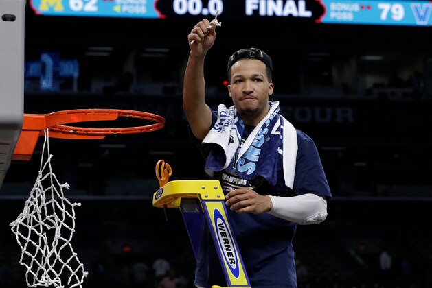 Villanova's Jalen Brunson cuts the net as he celebrates after the championship game of the Final Four NCAA college basketball tournament against Michigan, Monday, April 2, 2018, in San Antonio. Villanova won 79-62. (AP Photo/David J. Phillip)