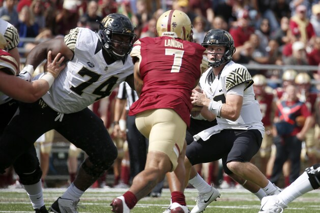 Boston College defensive end Harold Landry (7) rushes Wake Forest quarterback John Wolford (10) during the second half of an NCAA college football game, Saturday, Sept. 9, 2017, in Boston. (AP Photo/Mary Schwalm)