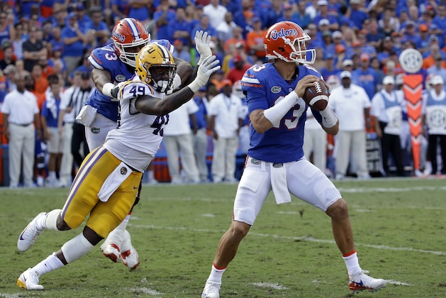 Florida quarterback Feleipe Franks (13) looks for a receiver as LSU linebacker Arden Key (49) puts on pressure during the first half of an NCAA college football game, Saturday, Oct. 7, 2017, in Gainesville, Fla.LSU won 17-16. (AP Photo/John Raoux) Florida quarterback Feleipe Franks (13) looks for a receiver as LSU linebacker Arden Key (49) puts on pressure during the first half of an NCAA college football game, Saturday, Oct. 7, 2017, in Gainesville, Fla.LSU won 17-16. (AP Photo/John Raoux)