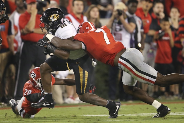 Missouri running back Damarea Crockett (16) is brought down by Georgia linebacker Lorenzo Carter (7) during the first half of an NCAA college football game Saturday, Oct. 14, 2017, in Athens, Ga. (AP Photo/John Bazemore)