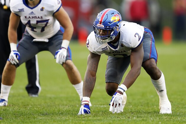 Kansas defensive end Dorance Armstrong Jr. (2) gets set for a play during the second half of an NCAA college football game against Iowa State, Saturday, Oct. 14, 2017, in Ames, Iowa. (AP Photo/Charlie Neibergall)