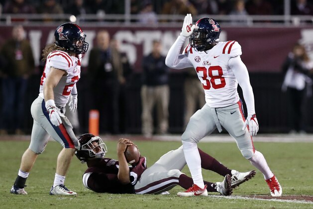 Mississippi defensive end Marquis Haynes (38) signs the land shark