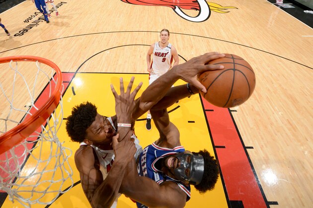 MIAMI, FL - APRIL 19:  Justice Winslow #20 of the Miami Heat blocks the shot of Joel Embiid #21 of the Philadelphia 76ers in Game Three of Round One of the 2018 NBA Playoffs on April 19, 2018 at American Airlines Arena in Miami, Florida. NOTE TO USER: User expressly acknowledges and agrees that, by downloading and or using this Photograph, user is consenting to the terms and conditions of the Getty Images License Agreement. Mandatory Copyright Notice: Copyright 2018 NBAE (Photo by Jesse D. Garrabrant/NBAE via Getty Images)