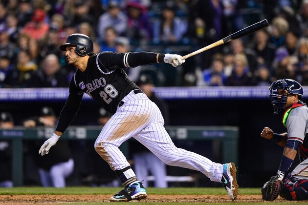 DENVER, CO - APRIL 7: Nolan Arenado #28 of the Colorado Rockies singles in the fifth inning of a game against the Colorado Rockies at Coors Field on April 7, 2018 in Denver, Colorado.  (Photo by Dustin Bradford/Getty Images)