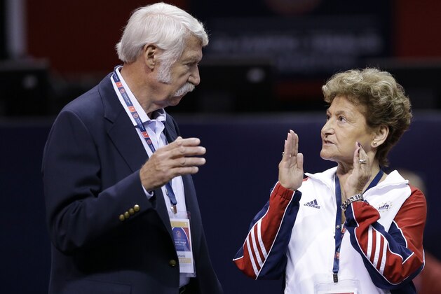 FILE - In this June 29, 2012, file photo, Bela Karolyi, left, and his wife Martha Karolyi talk on the arena floor before the start of the preliminary round of the women's Olympic gymnastics trials in San Jose, Calif. The latest lawsuit filed Thursday, Oct. 27, 2016, accusing Dr. Larry Nassar, a former USA Gymnastics doctor, of sexually abusing a longtime member of the U.S. women's national team is the first to name renowned husband-and-wife coaches Bela and Martha Karolyi, alleging they turned a blind eye to molestations. The Karolyis did not return messages seeking comment. (AP Photo/Gregory Bull, File)