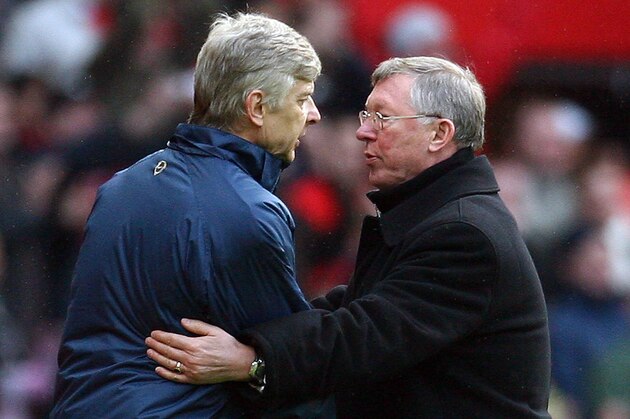 Manchester United manager Sir Alex Ferguson (R) shakes hands with Arsenal manager Arsene Wenger after their English Premier League football match at Old Trafford in Manchester, north west England on April 13, 2008. United won the game 2-1. AFP PHOTO/PAUL ELLIS - Mobile and website use of domestic English football pictures are subject to obtaining a Photographic End User Licence from Football DataCo Ltd Tel : +44 (0) 207 864 9121 or e-mail accreditations@football-dataco.com - applies to Premier and Football League matches. (Photo credit should read PAUL ELLIS/AFP/Getty Images)