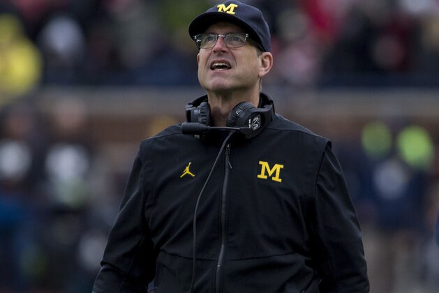Michigan head coach Jim Harbaugh looks up at the scoreboard in the second quarter of an NCAA college football game against Ohio State in Ann Arbor, Mich., Saturday, Nov. 25, 2017. (AP Photo/Tony Ding)