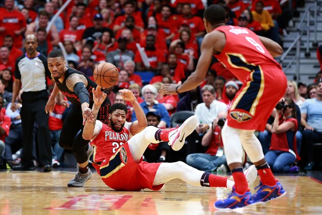 NEW ORLEANS, LA - APRIL 19:  Anthony Davis #23 of the New Orleans Pelicans steals the ball from Damian Lillard #0 of the Portland Trail Blazers during Game 3 of the Western Conference playoffs at the Smoothie King Center on April 19, 2018 in New Orleans, Louisiana. NOTE TO USER: User expressly acknowledges and agrees that, by downloading and or using this photograph, User is consenting to the terms and conditions of the Getty Images License Agreement.  (Photo by Sean Gardner/Getty Images)