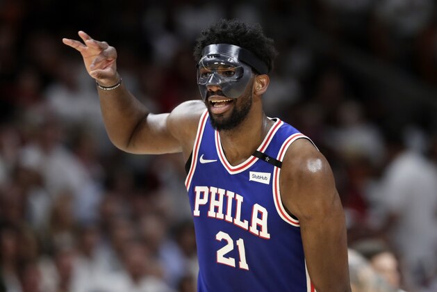 Philadelphia 76ers' Joel Embiid (21) reacts after scoring during the second half of Game 3 of a first-round NBA basketball playoff series against the Miami Heat, Thursday, April 19, 2018, in Miami. The 76ers won 128-108. (AP Photo/Lynne Sladky)