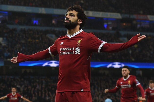 Liverpool's Egyptian midfielder Mohamed Salah celebrates scoring his team's first goal during the UEFA Champions League second leg quarter-final football match between Manchester City and Liverpool, at the Etihad Stadium in Manchester, north west England on April 10, 2018.
Liverpool won the match 2-1. / AFP PHOTO / PAUL ELLIS        (Photo credit should read PAUL ELLIS/AFP/Getty Images)
