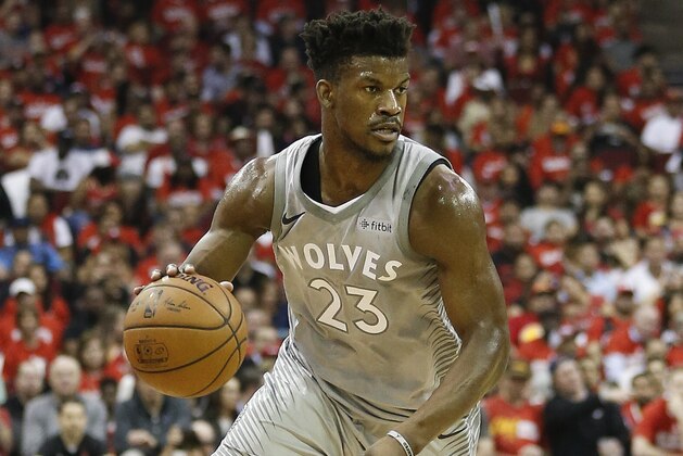 HOUSTON, TX - APRIL 18: Jimmy Butler #23 of the Minnesota Timberwolves brings the ball up court against the Houston Rockets during Game Two of the first round of the Western Conference playoffs at Toyota Center on April 18, 2018 in Houston, Texas. NOTE TO USER: User expressly acknowledges and agrees that, by downloading and or using this photograph, User is consenting to the terms and conditions of the Getty Images License Agreement.  (Photo by Bob Levey/Getty Images)