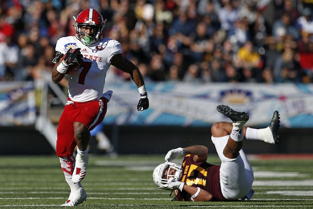 North Carolina State running back Nyheim Hines (7) eludes Arizona State defensive back J'Marcus Rhodes (17) to pick up a first down during the first half of the Sun Bowl NCAA college football game in El Paso, Texas, Friday, Dec. 29, 2017. (AP Photo/Andres Leighton)