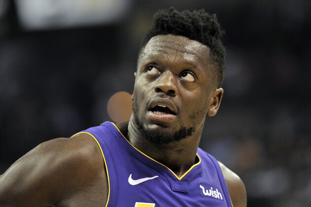 Los Angeles Lakers forward Julius Randle stands on the court in the first half of an NBA basketball game against the Memphis Grizzlies Saturday, March 24, 2018, in Memphis, Tenn. (AP Photo/Brandon Dill)
