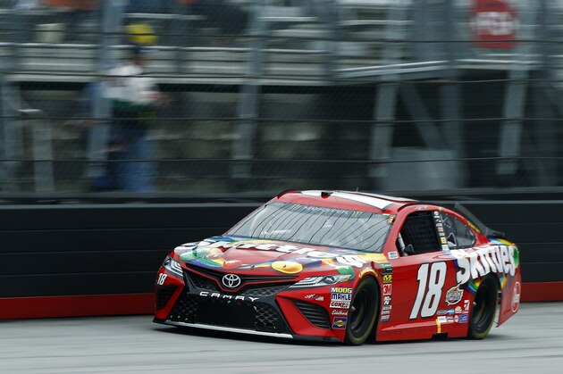 Kyle Busch leads during a NASCAR Cup Series auto race, Sunday, April 15, 2018, in Bristol, Tenn. (AP Photo/Wade Payne)