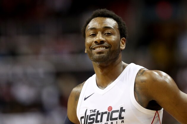 WASHINGTON, DC - APRIL 20: John Wall #2 of the Washington Wizards looks on against the Toronto Raptors in the first half during Game Three of Round One of the 2018 NBA Playoffs at Capital One Arena on April 20, 2018 in Washington, DC. NOTE TO USER: User expressly acknowledges and agrees that, by downloading and or using this photograph, User is consenting to the terms and conditions of the Getty Images License Agreement. (Photo by Rob Carr/Getty Images)