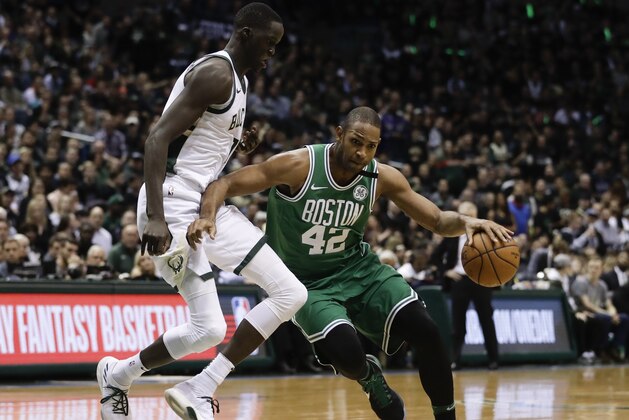 Boston Celtics' Al Horford tries to drive past Milwaukee Bucks' Thon Maker during the second half of Game 3 of an NBA basketball first-round playoff series Friday, April 20, 2018, in Milwaukee. (AP Photo/Morry Gash)
