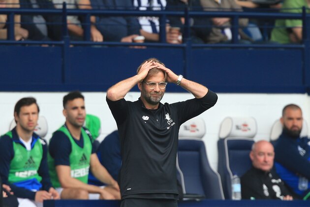 Liverpool's German manager Jurgen Klopp gestures on the touchline during the English Premier League football match between West Bromwich Albion and Liverpool at The Hawthorns stadium in West Bromwich, central England, on April 21, 2018. (Photo by Lindsey PARNABY / AFP) / RESTRICTED TO EDITORIAL USE. No use with unauthorized audio, video, data, fixture lists, club/league logos or 'live' services. Online in-match use limited to 75 images, no video emulation. No use in betting, games or single club/league/player publications. /         (Photo credit should read LINDSEY PARNABY/AFP/Getty Images)