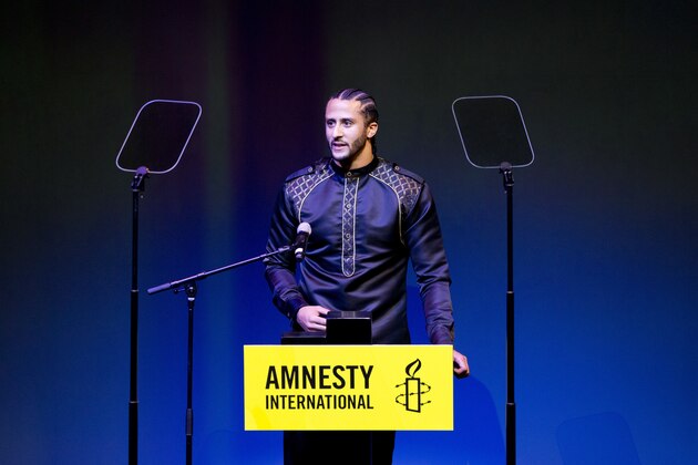 Former NFL quarterback and social justice activist Colin Kaepernick speeches after receiving the Amnesty International Ambassador of Conscience Award for 2018 in Amsterdam, Saturday April 21, 2018. Kaepernick became a controversial figure when refusing to stand for the national anthem, instead he knelt to protest racial inequality and police brutality. (AP Photo/Peter Dejong)