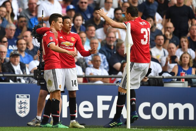 Manchester United's Spanish midfielder Ander Herrera (L) celebrates with Manchester United's English midfielder Jesse Lingard (C) and Manchester United's Serbian midfielder Nemanja Matic after scoring the team's second goal  during the English FA Cup semi-final football match between Tottenham Hotspur and Manchester United at Wembley Stadium in London, on April 21, 2018. (Photo by Ben STANSALL / AFP) / NOT FOR MARKETING OR ADVERTISING USE / RESTRICTED TO EDITORIAL USE        (Photo credit should read BEN STANSALL/AFP/Getty Images)