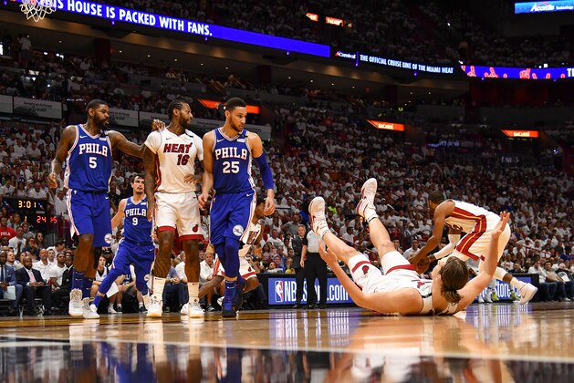 MIAMI, FL - APRIL 21: Ben Simmons #25 of the Philadelphia 76ers runs into Kelly Olynyk #9 of the Miami Heat in the first quarter during Game Four of Round One of the 2018 NBA Playoffs at American Airlines Arena on April 21, 2018 in Miami, Florida. NOTE TO USER: User expressly acknowledges and agrees that, by downloading and or using this photograph, User is consenting to the terms and conditions of the Getty Images License Agreement. (Photo by Mark Brown/Getty Images)