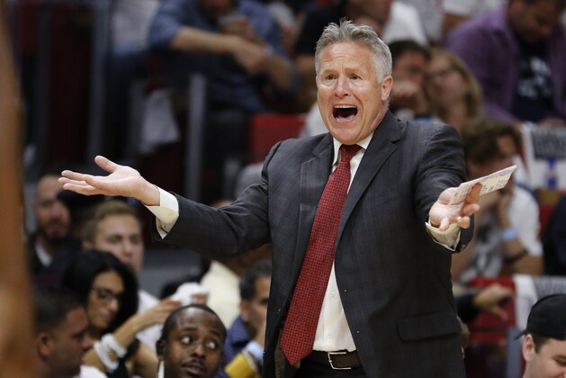 Philadelphia 76ers head coach Brett Brown directs his team in the first quarter of play against the Miami Heat in Game 4 of a first-round NBA basketball playoff series, Saturday, April 21, 2018, in Miami. (AP Photo/Joe Skipper)