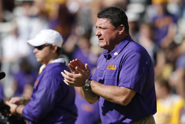 LSU head coach Ed Orgeron walks on the field before an NCAA college football game against Arkansas in Baton Rouge, La., Saturday, Nov. 11, 2017. (AP Photo/Gerald Herbert)