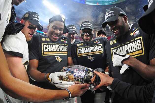 ATLANTA, GA - JANUARY 1: Members of the Central Florida Knights celebrate after the game against the Auburn Tigers during the Chick-fil-A Peach Bowl on January 1, 2018 in Atlanta, Georgia. (Photo by Scott Cunningham/Getty Images)