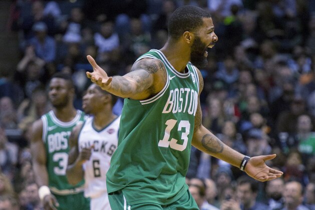 Boston Celtics forward Marcus Morris looks for a foul call after driving to the basket against the Milwaukee Bucks during the second half of an NBA basketball game Tuesday, April 3, 2018, in Milwaukee. (AP Photo/Darren Hauck)