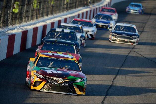 RICHMOND, VA - APRIL 21:  Kyle Busch, driver of the #18 M&M's Flavor Vote Toyota, leads a pack of cars during the Monster Energy NASCAR Cup Series Toyota Owners 400 at Richmond Raceway on April 21, 2018 in Richmond, Virginia.  (Photo by Robert Laberge/Getty Images)