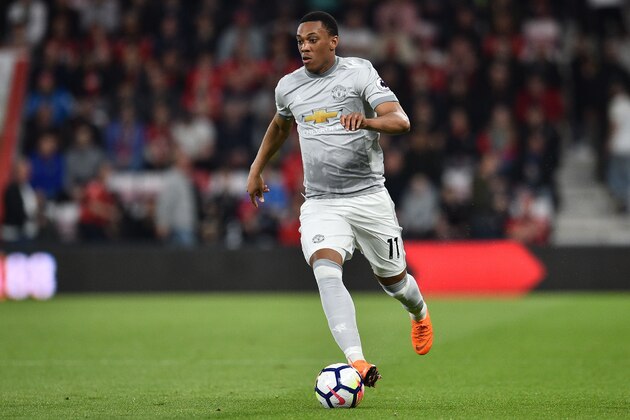 Manchester United's French striker Anthony Martial runs with the ball during the English Premier League football match between Bournemouth and Manchester United at the Vitality Stadium in Bournemouth, southern England on April 18, 2018. / AFP PHOTO / Glyn KIRK / RESTRICTED TO EDITORIAL USE. No use with unauthorized audio, video, data, fixture lists, club/league logos or 'live' services. Online in-match use limited to 75 images, no video emulation. No use in betting, games or single club/league/player publications.  /         (Photo credit should read GLYN KIRK/AFP/Getty Images)