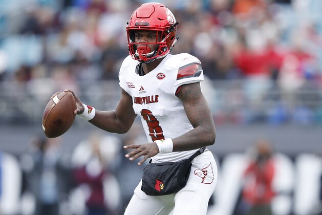 JACKSONVILLE, FL - DECEMBER 30: Lamar Jackson #8 of the Louisville Cardinals looks to pass against the Mississippi State Bulldogs during the TaxSlayer Bowl at EverBank Field on December 30, 2017 in Jacksonville, Florida. The Bulldogs won 31-27. (Photo by Joe Robbins/Getty Images)