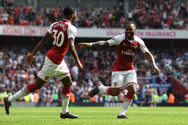LONDON, ENGLAND - APRIL 22:  Alexandre Lacazette of Arsenal celebrates scoring his side's fourth goal with Ainsley Maitland-Niles during the Premier League match between Arsenal and West Ham United at Emirates Stadium on April 22, 2018 in London, England.  (Photo by Shaun Botterill/Getty Images)