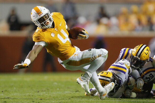 KNOXVILLE, TN - NOVEMBER 18:  John Kelly #4 of the Tennessee Volunteers dives for a first down against the LSU Tigers at Neyland Stadium on November 18, 2017 in Knoxville, Tennessee.  (Photo by Michael Reaves/Getty Images)